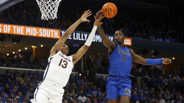 Memphis Tigers forward David Jones (8) steals the ball from Virginia Cavaliers guard Ryan Dunn (13) during the second half at FedExForum.
